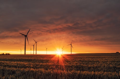 Wind turbines with sunset